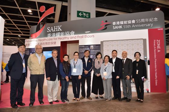 (From Left) Mr. Kenneth K. L. Lee, Deputy Chief Executive Officer; Mr. David P. W. Yau, Vice Chairperson; Mr. Benjamin K. M. Wong, Council Member; Ms Chu Koh Ann , Honorary Secretary cum Chairperson of Adult Service Management Committee; Mrs. Josephine M. W. Tsui Pang, Chairperson; Mr. Kevin C. C. Ko, Council Member; Dr. Jennifer W. W. Ma Myint, Adult Service Management Committee Member; Mrs. Louisa Law, Deputy Chief Executive Officer; Mr. Eddie K. T. Suen, Chief Executive Officer; Dr. Ivan Y. W. Su, the Association’s Senior Manager (Professional Development) and Mrs. Lorraine M. K. Hui Shum, Head of Service, took a photo together in front of the Association’s booth. 