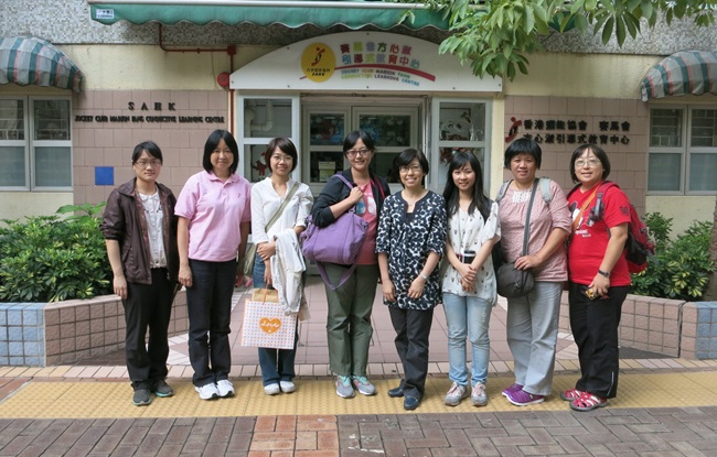 The visiting tour of The First Social Welfare Foundation took a photo with our staff outside the Jockey Club Marion Fang Conductive Learning Centre. 