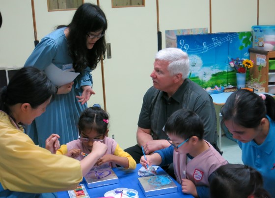  Mr. John Bernhardt visited the centres to observe children’s classes. 