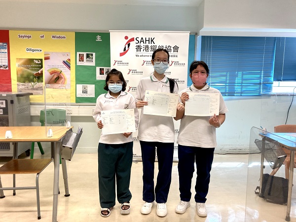 Students from SAHK B M Kotewall Memorial School complete the HKDSE.