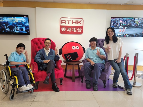 Mr. MA Hon Ming, the music teacher(second from left), student OU Wai Kin(first from left)and LEE Yi Fan(second from right)from Jockey Club Elaine Field School were interviewed by RTHK. Mr. MA Hon Ming, the music teacher(second from left), student OU Wai Kin(first from left)and LEE Yi Fan(second from right)from Jockey Club Elaine Field School were interviewed by RTHK.